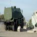 A KrAZ Fiona with a KrAZ Cougar in the background.