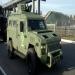 A KrAZ Cougar with the test track in the background.