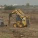 Skid steer with an auger