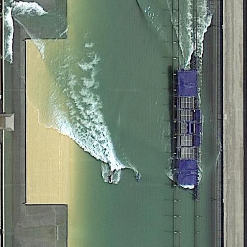 Surfer on man made wave in Lemoore, CA (Google Maps)