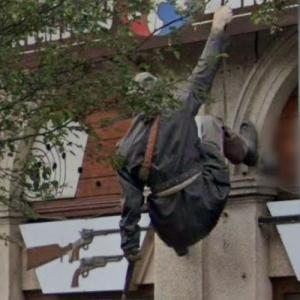 Wall climber sculpture (StreetView)