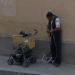 Man transporting stuff on a stroller