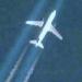 Airplane with contrail over Chesapeake Bay